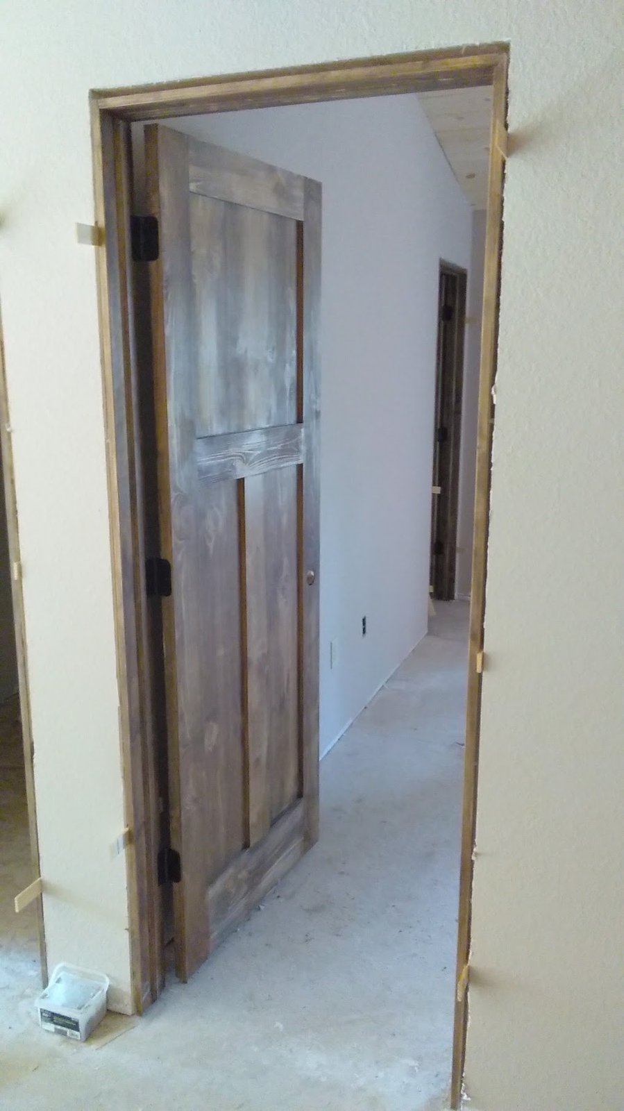 Brookfield craftsman door hang with shims during remodel.