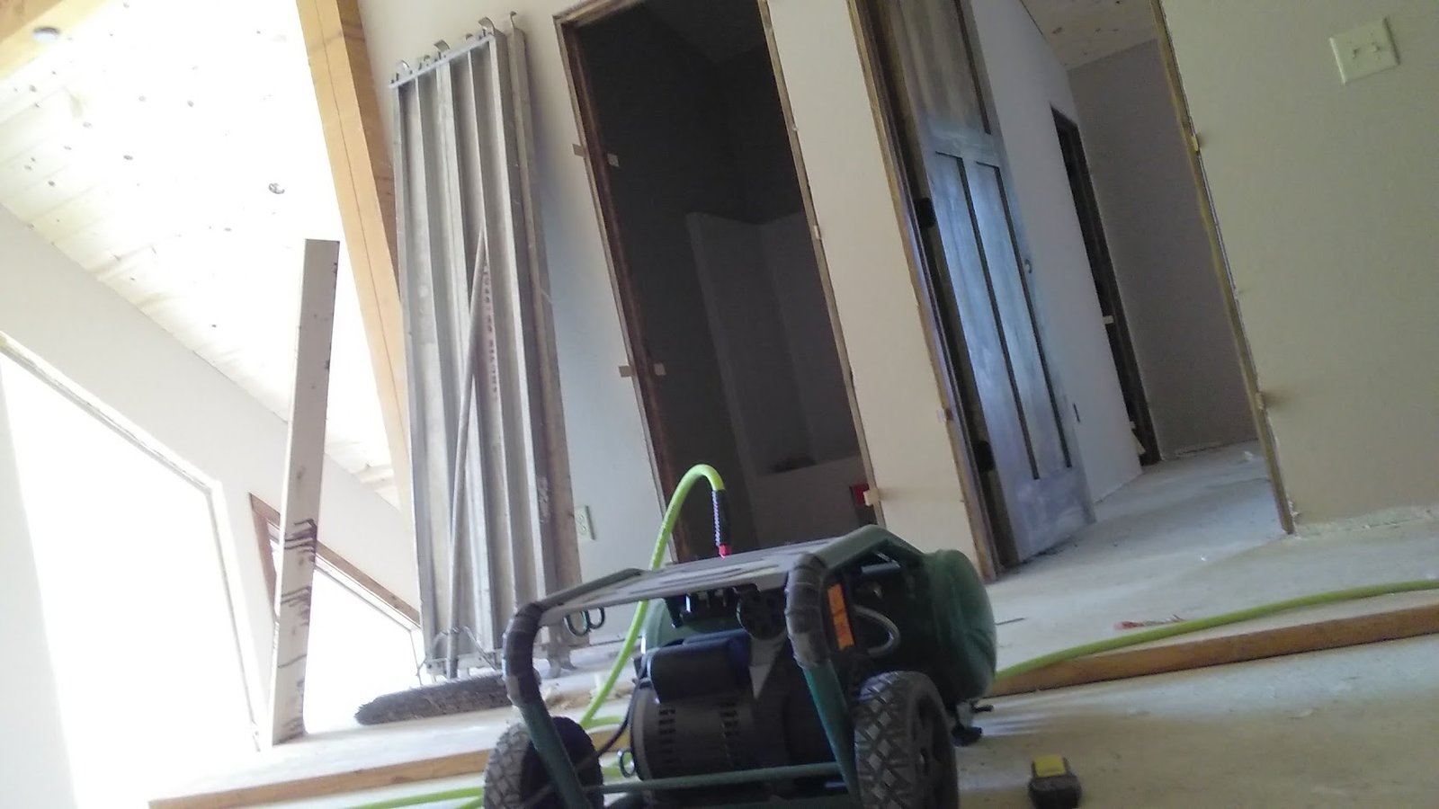 Brookfield remodel interior — air compressor and hallway during construction.