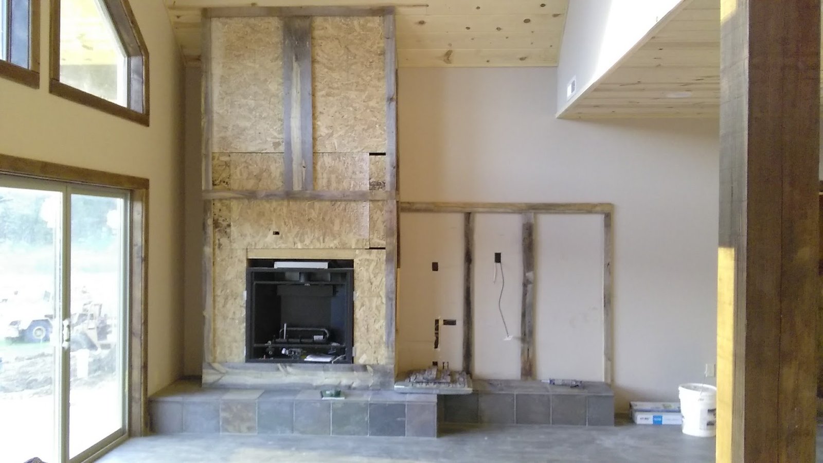 Brookfield fireplace chase framing and tile hearth during remodel.
